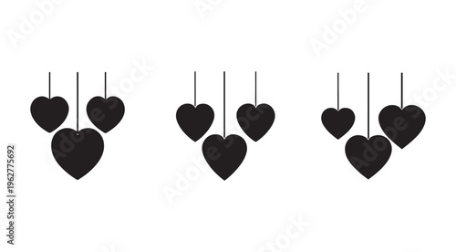 Black hearts hanging from strings on white background  heart shapes  love symbols  decorative elements