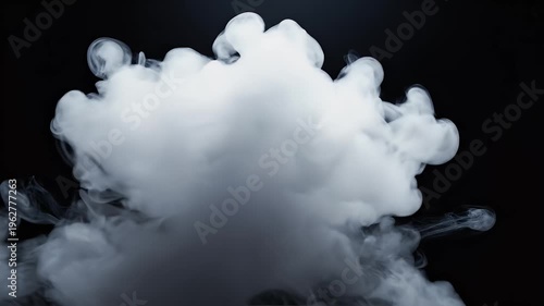 White smoke billows in dark, illuminated from above