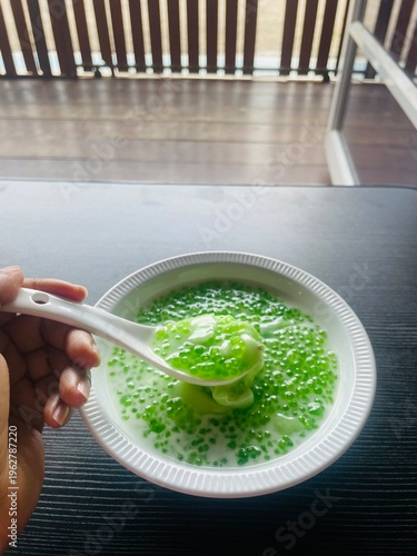 Traditional Tapioca pearls pudding with tender young coconut slices and coconut cream