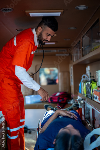 Фотография Paramedic ambulance emergency healthcare first aid stethoscope patient stretcher