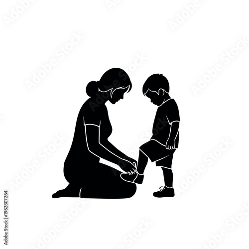 Mother helping son tie shoelaces silhouette.