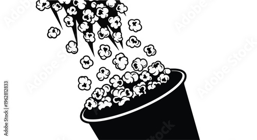 Popcorn spills from a bucket, creating a dynamic cascade of fluffy kernels against a stark white background, perfect for entertainment concepts.