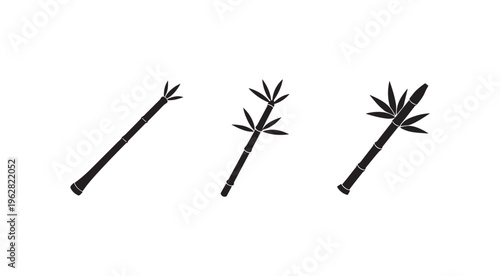 Black bamboo sticks with leaves on white background for design and decoration purposes  simple black bamboo sticks with leaves on white background for design and decoration purposes