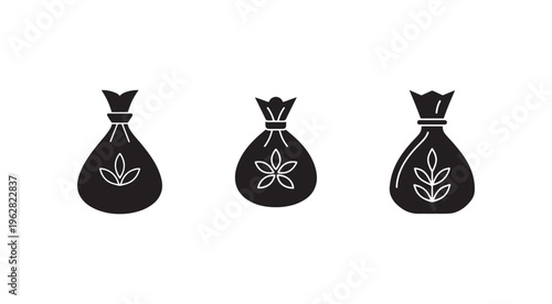 Black money bags with white leaf designs on white background  financial and ecofriendly concepts