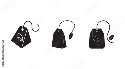 Black tea bag icons with leaf designs on white background  tea tags with string and leaf illustrations