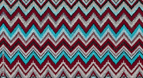 a vibrant textile featuring a seamless yakan weave pattern in maroon, blue, and white, ideal for design, fashion, and cultural projects