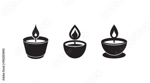 Set of simple black silhouette tea light candles with flames burning in holders isolated on white background