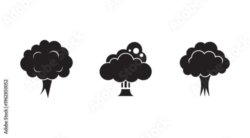 Three black mushroom cloud silhouettes on white background  nuclear explosion icons  pollution and environmental disaster symbols