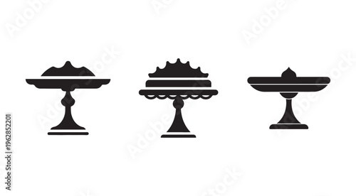 Three black silhouettes of decorative cake stands with cakes on top  isolated on white background