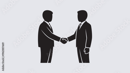 Two businessmen shaking hands in a professional setting