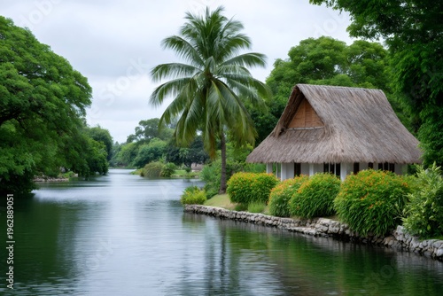 Tropical hut with thatched roof relaxing by river