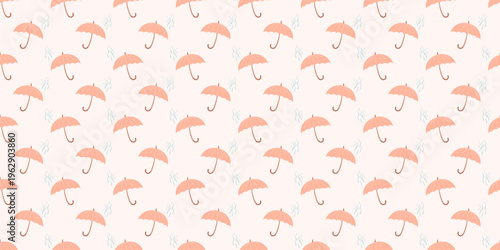 Seamless pattern of small umbrellas scattered across a soft pastel background.