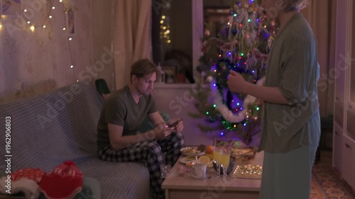 People celebrate New Year's and Christmas in a cozy home.