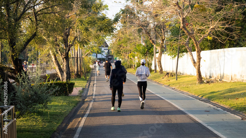 Life lifestyle thai people and fitness enthusiast training jogging and walk run exercise workout in Somdet Phra Srinagarindra Park or Suan Somdet Ya Public Garden at Pak Kret in Nonthaburi, Thailand