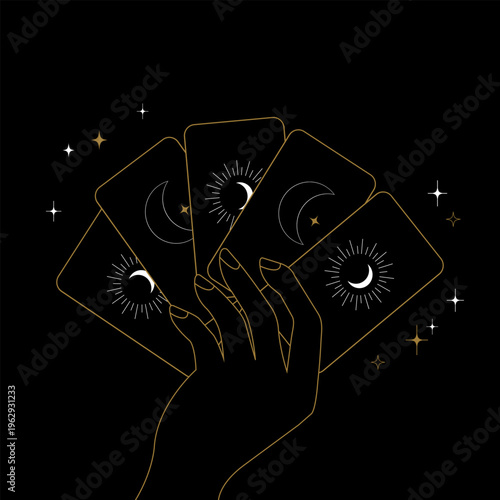 hand with tarot cards on a black background