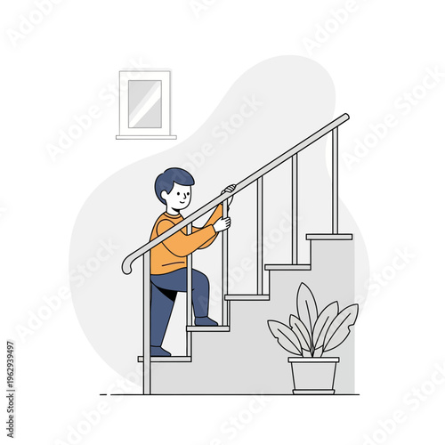 Young boy safely climbing stairs holding onto the railing indoors