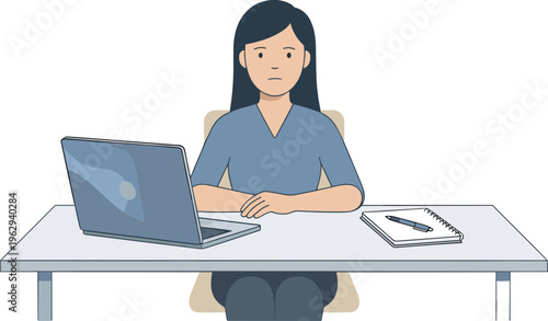 Woman sits at desk working on laptop with notebook nearby indoors