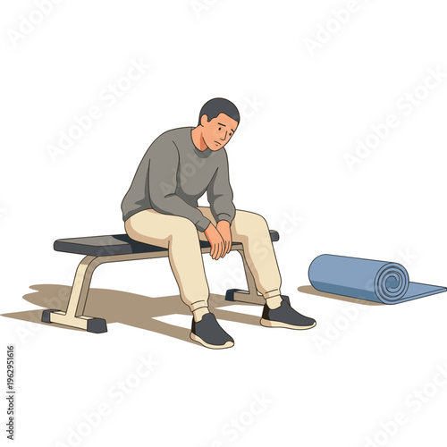 A man sits dejected on a gym bench next to a rolled yoga mat indoors.