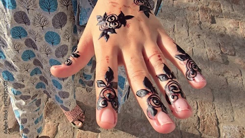 henna design intricately painted on hands showcasing detailed patterns and floral motifs in henna art