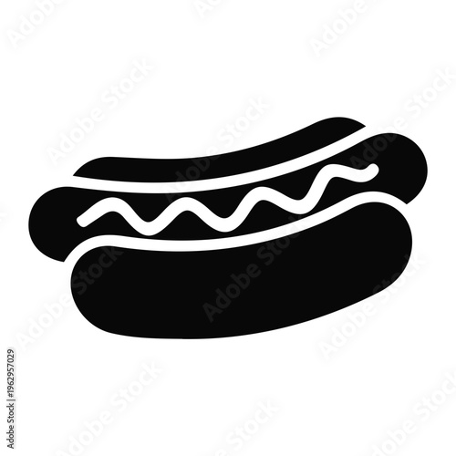 Delicious hot dog with condiments on a bun placed on table