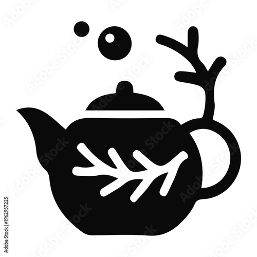 A steaming teapot with a leaf design and antler handle emits vapor.