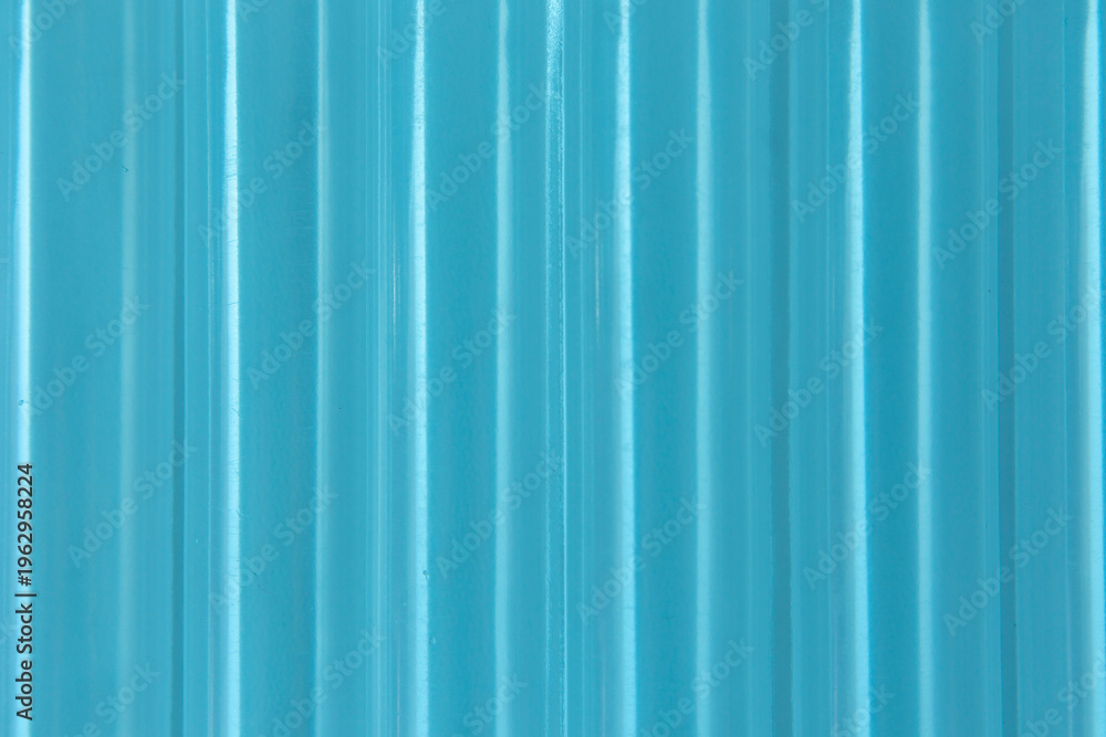 Obraz premium Abstract ribbed smooth blue striped plastic pattern or texture as background