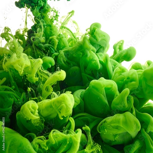 Vibrant green ink swirling in water, creating fluid organic shapes