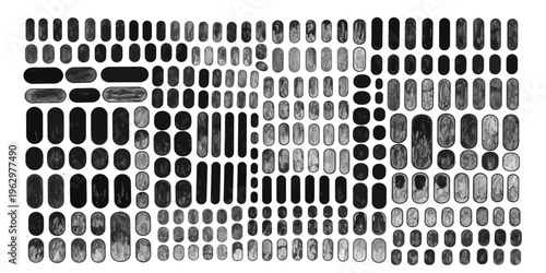 A large collection of variously shaped and sized black and gray stones or pebbles arranged in a grid pattern