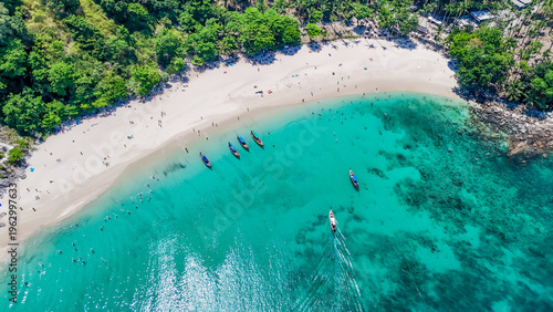 Stunning aerial view of the beach. An aerial photograph of the beautiful tropical beach and sea on Phuket Island. Located at Freedom Beach, Phuket, Thailand, at 10 am – the start of sunbathing, summer