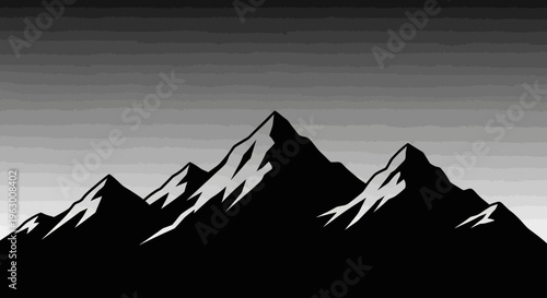 Majestic Mountain Peaks Silhouette Against Grayscale Sky.