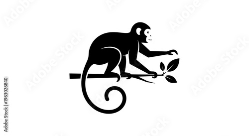 Silhouette of a monkey sitting on a branch reaching for leaves.