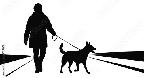 Silhouette of a person walking a dog on a leash.