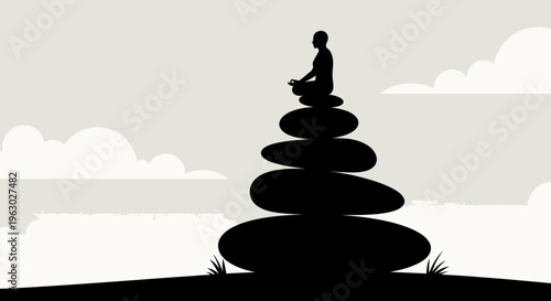 Silhouette of person meditating atop stacked stones.