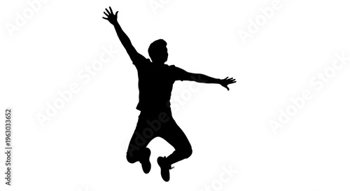 Silhouette of a joyful person jumping high in the air.