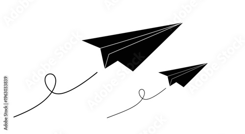 Two black paper airplanes flying in formation.