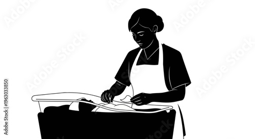 Silhouette of a person doing laundry indoors.