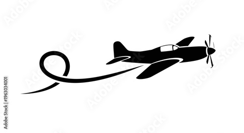Silhouette of a vintage airplane performing an aerobatic loop.