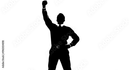 Silhouette of a triumphant businessman raising his fist.