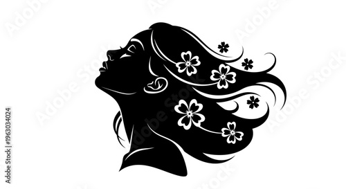 Elegant Silhouette of a Woman with Flowing Hair and Flowers.