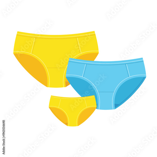 Three pairs of colorful underwear for kids on plain surface
