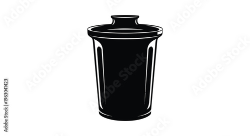 A black trash can depicted in a stark dramatic silhouette