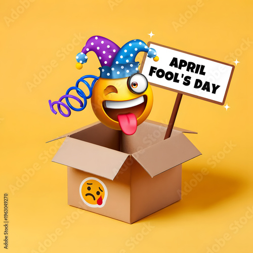 A cheerful emoji wearing a jester hat pops out of a cardboard box on april fools day with a sign and a spring, set against a vibrant yellow background