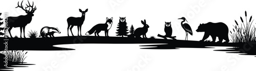 Silhouette of various animals standing near a serene body of water in a natural setting outdoors