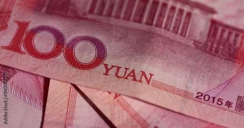 Chinese money with a face value of 100 yuan, Chinese cash in red with national symbols of China, closeup