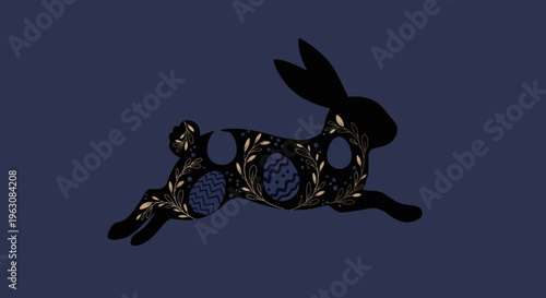 Intricate golden floral pattern adorns a dark silhouette of a running rabbit.