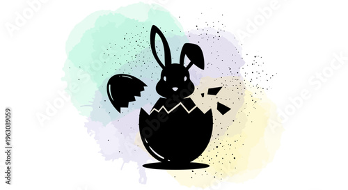 Silhouette of an Easter bunny emerging from a cracked egg.