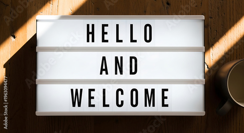 Brightly illuminated lightbox sign warmly extending a heartfelt welcome and cheerful greeting message to all visitors