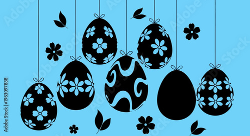 Easter eggs with floral patterns hanging on strings.
