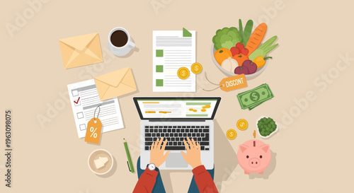 Hands on laptop with finance items.