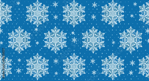 Beautiful seamless winter pattern featuring intricate white snowflakes and small dots on a bright blue background for seasonal gift wrapping.